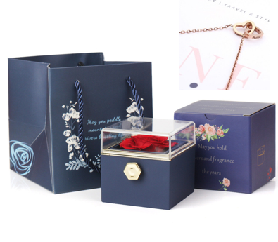 Heart-shaped necklace and rotating rose jewelry box