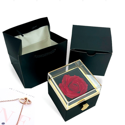 Heart-shaped necklace and rotating rose jewelry box