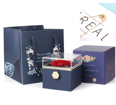 Heart-shaped necklace and rotating rose jewelry box