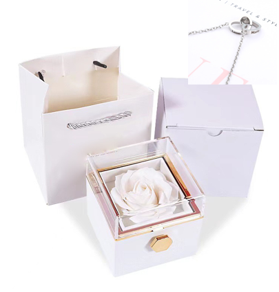 Heart-shaped necklace and rotating rose jewelry box