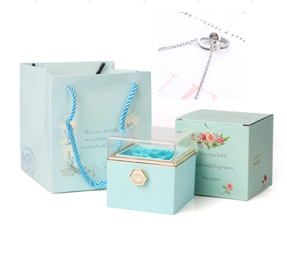 Heart-shaped necklace and rotating rose jewelry box