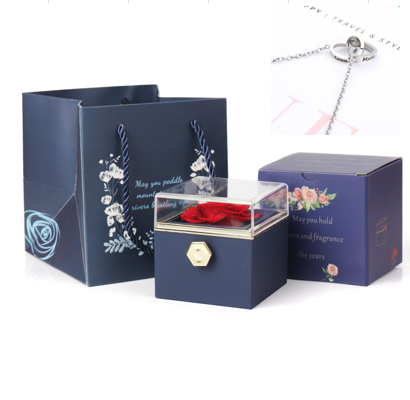 Heart-shaped necklace and rotating rose jewelry box