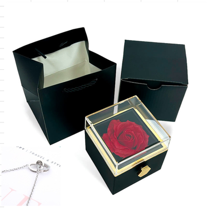 Heart-shaped necklace and rotating rose jewelry box