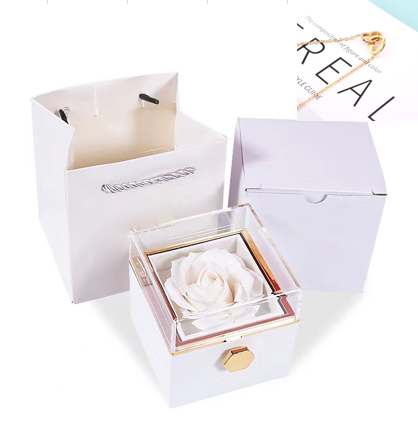 Heart-shaped necklace and rotating rose jewelry box