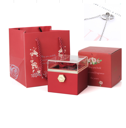 Heart-shaped necklace and rotating rose jewelry box